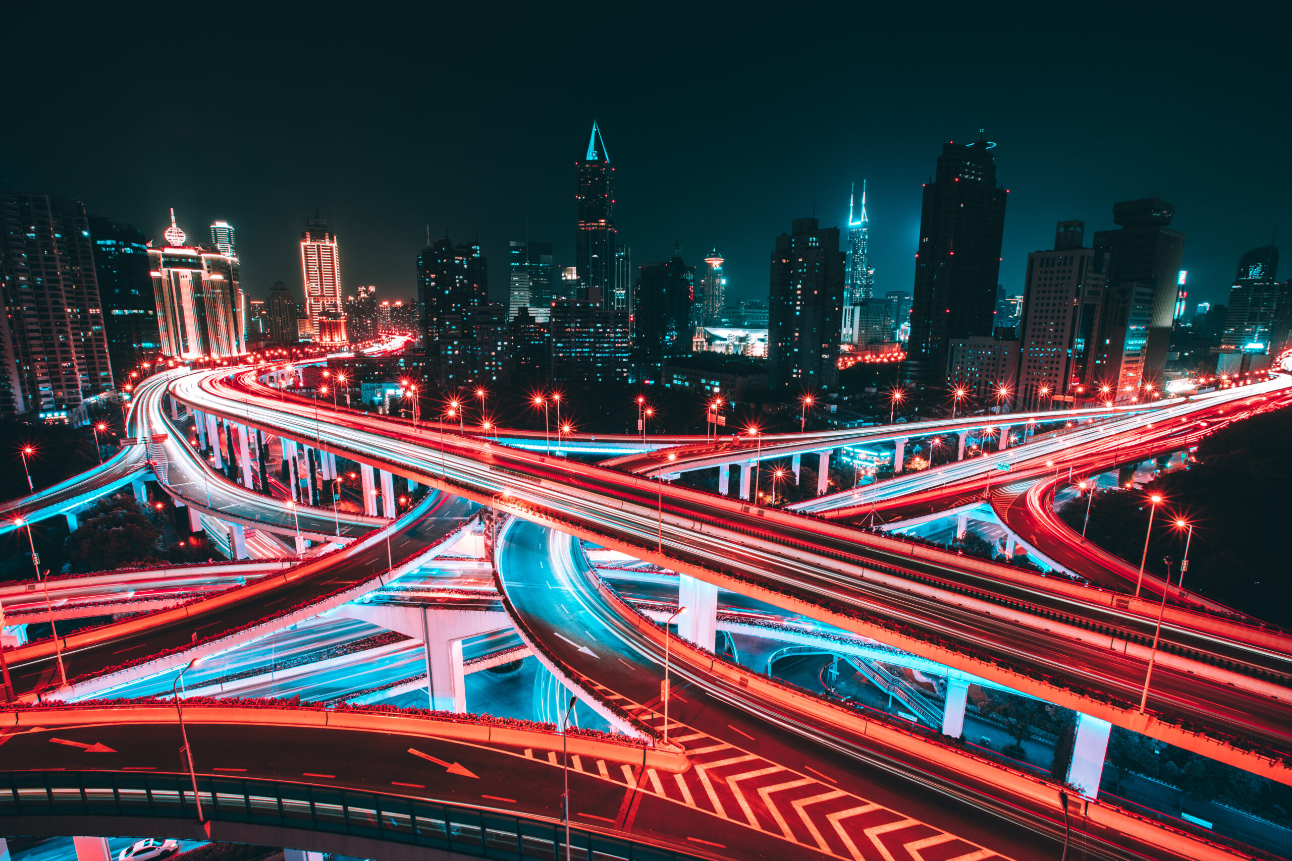 Aerial view of road intersection in Shanghai at night, with blurred motion